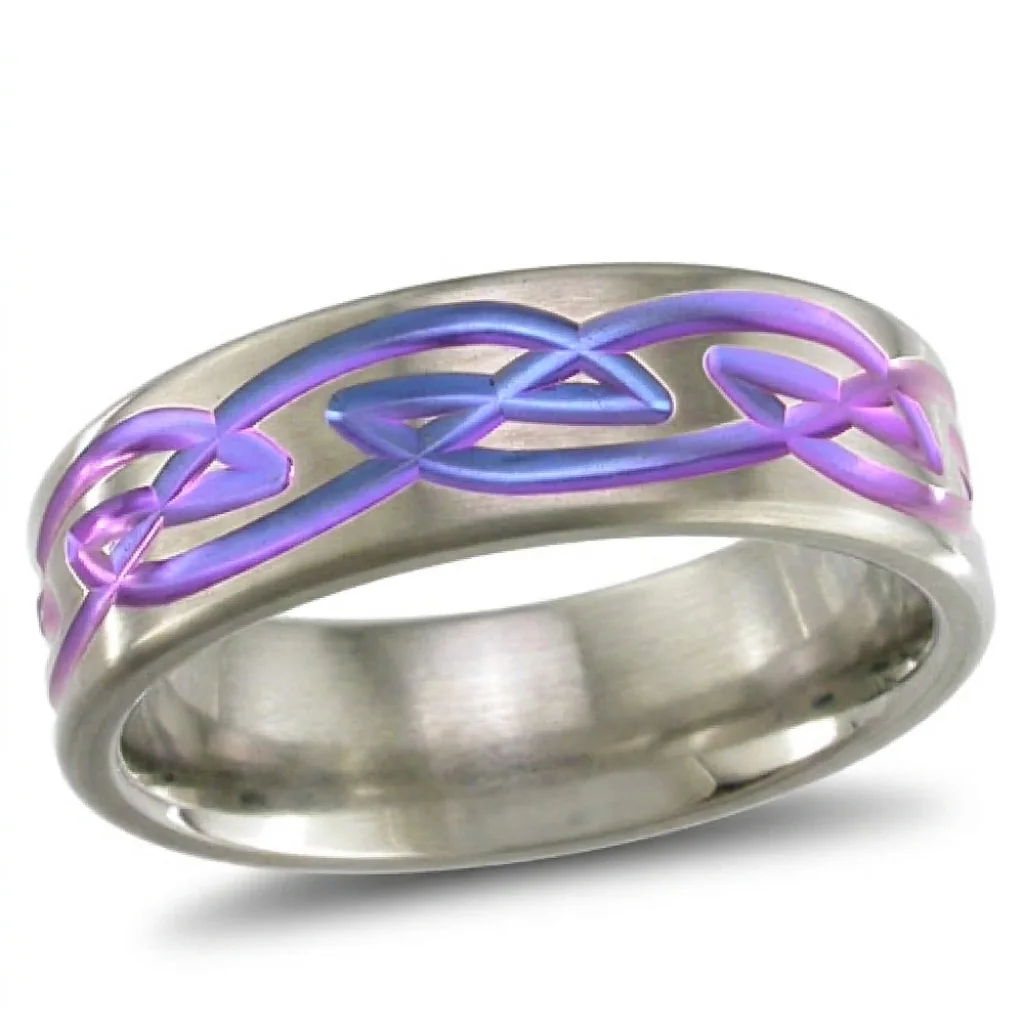 Celtic, anodised, Celtic knotwork, cut into the band and then coloured.
