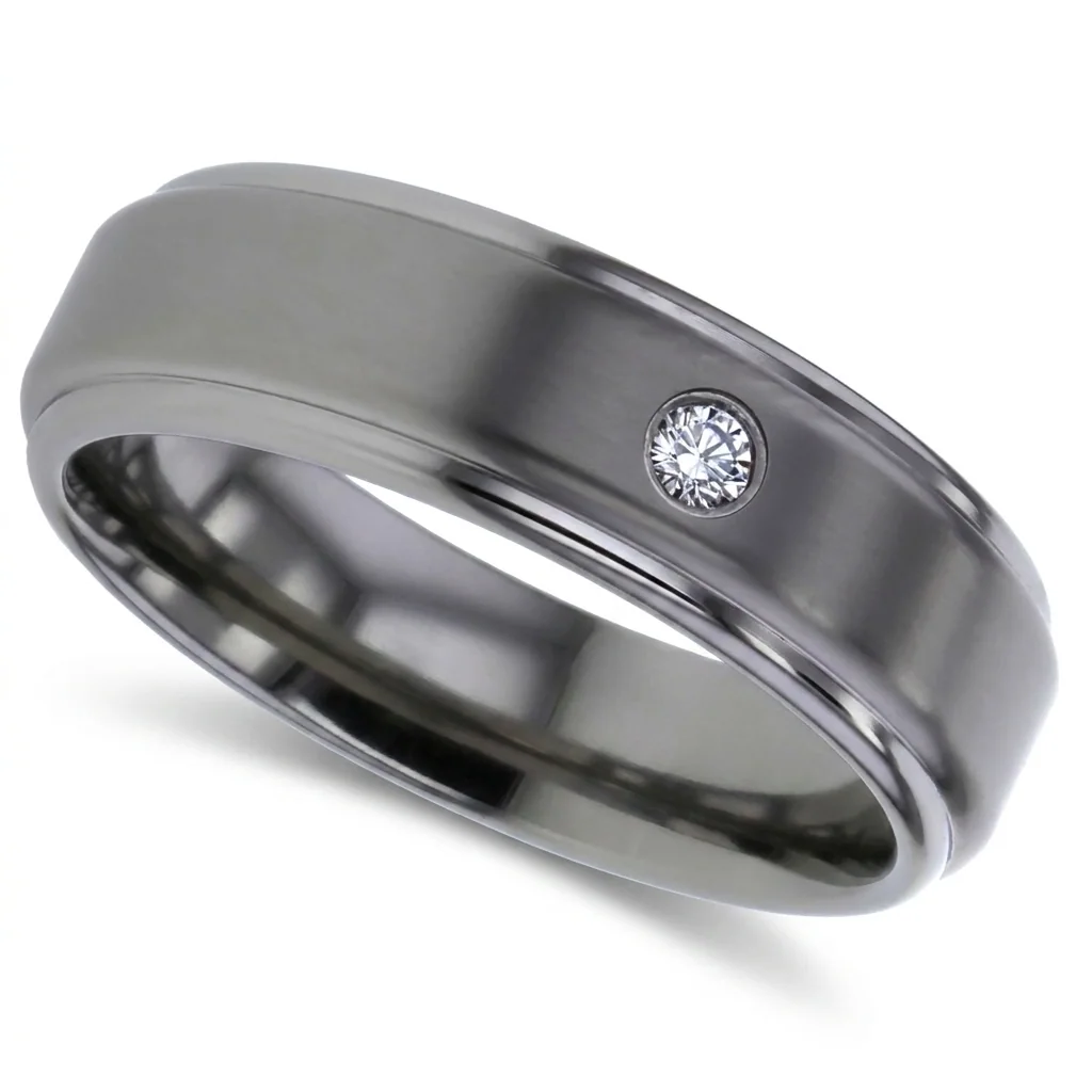 Diamond set, titanium, One small diamond, flush set into brushed titanium.
