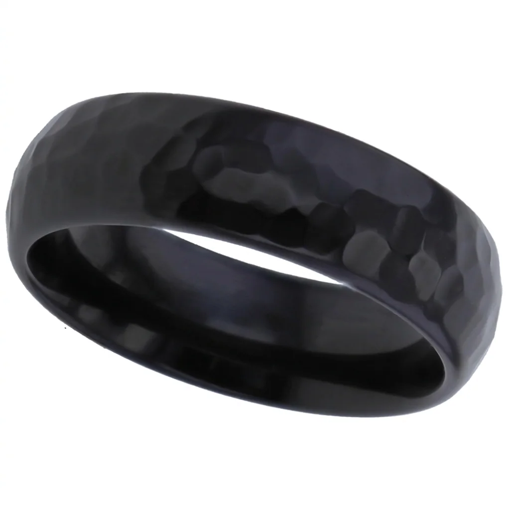 A domed black zirconium band, hammered across its whole surface