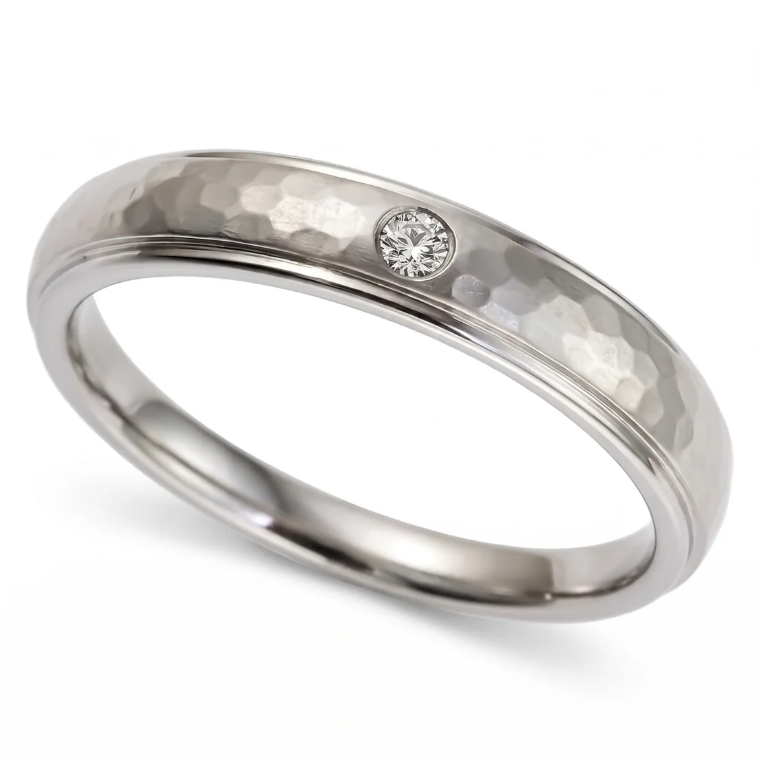 Hammered titanium, diamond set, Hand hammered titanium with one flush set diamond.