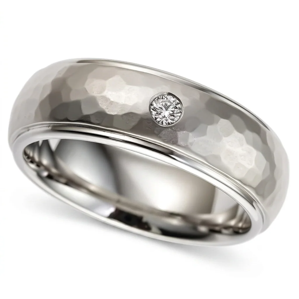 Hammered titanium, diamond set, Hand hammered titanium with one flush set diamond.