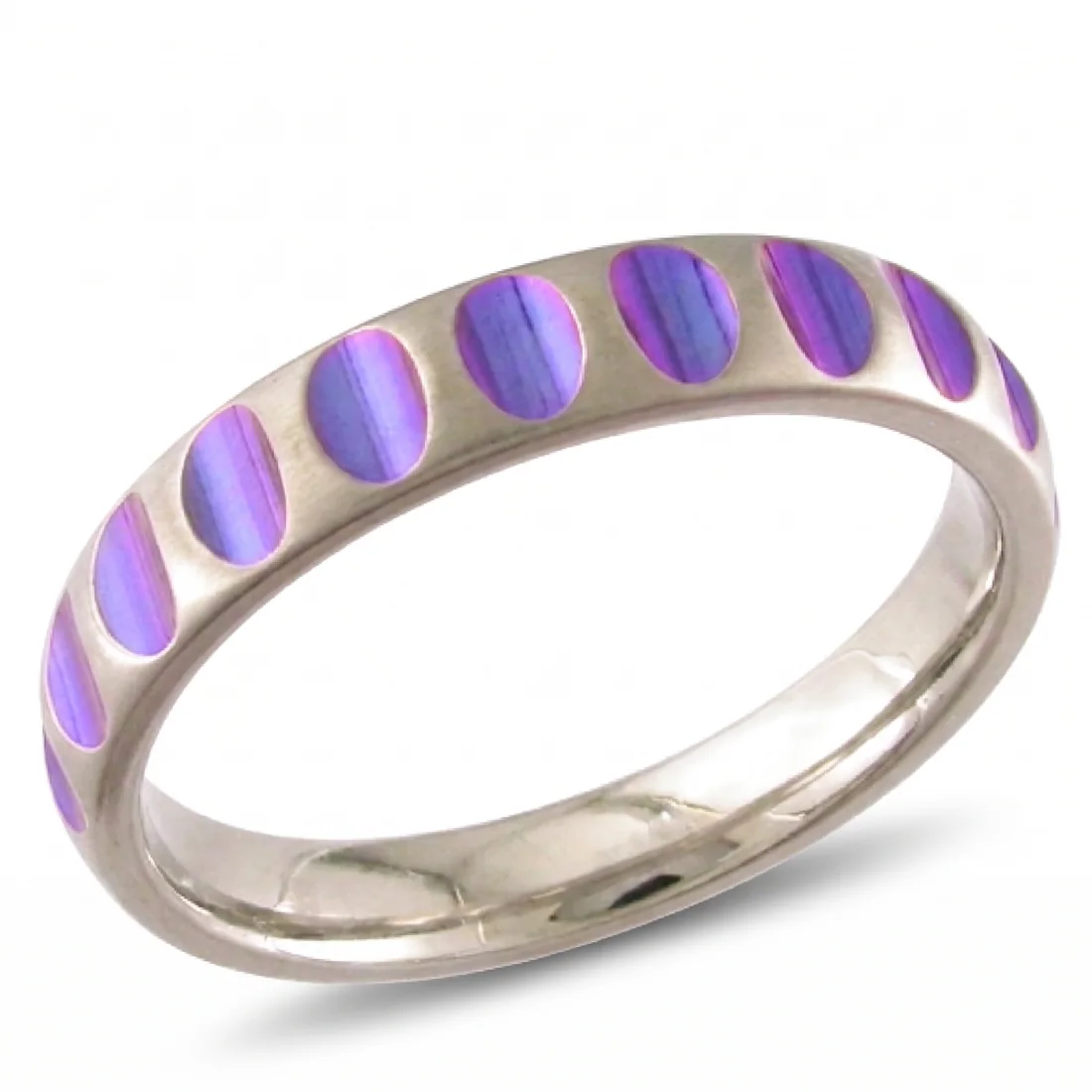 Ovals, anodised, A row of coloured ovals around a bright band.