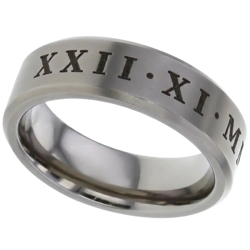A titanium band with chamfered edges engraved with a date in Roman numerals