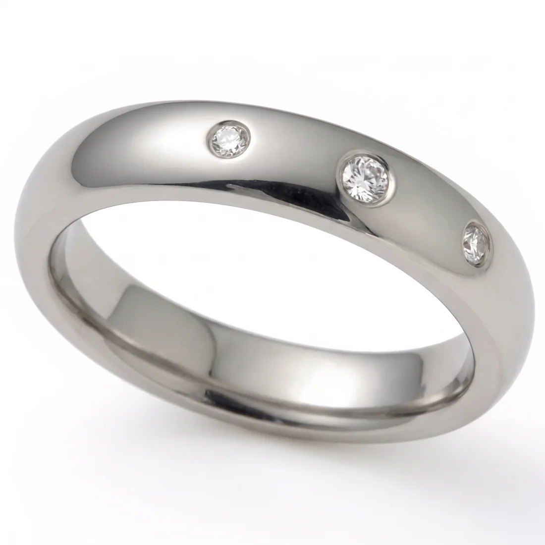 Three diamonds, titanium, Three diamonds in a row, flush set in polished titanium.