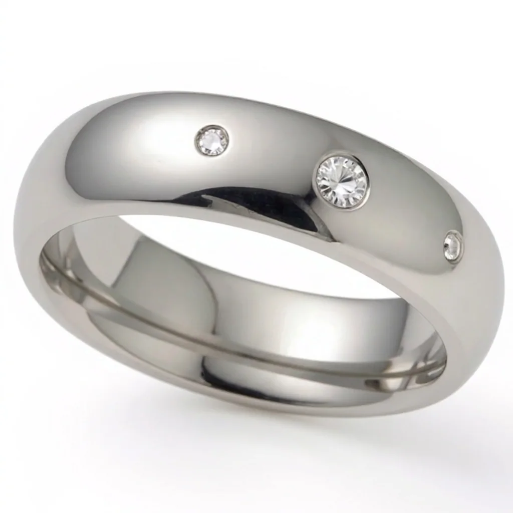 Three diamonds, titanium, Three diamonds in a row, flush set in polished titanium.