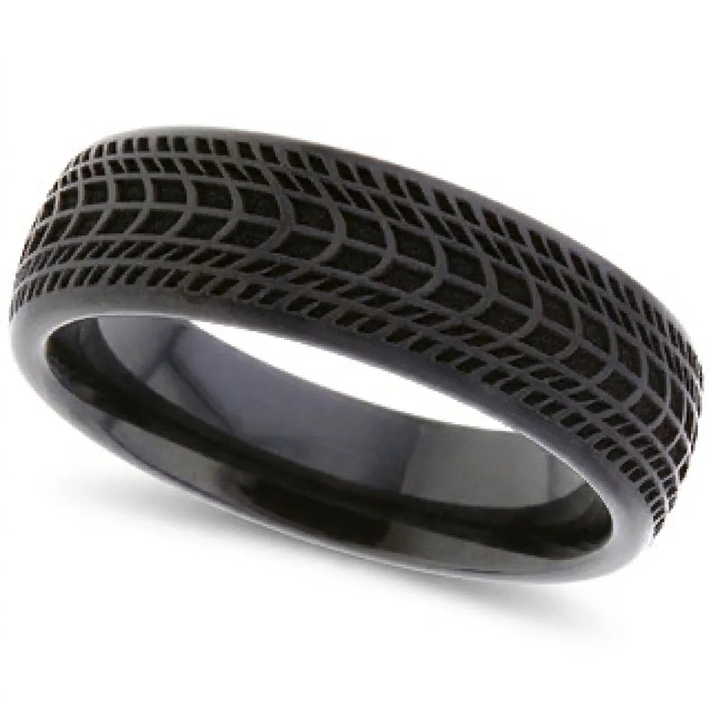 Tyre tread, black, A tyre tread, cut around a black zirconium band.